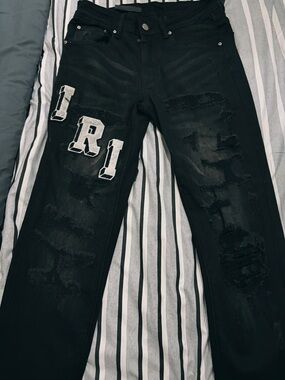 Amiri Black Distressed Men’s Jeans with White 'R1' Patch